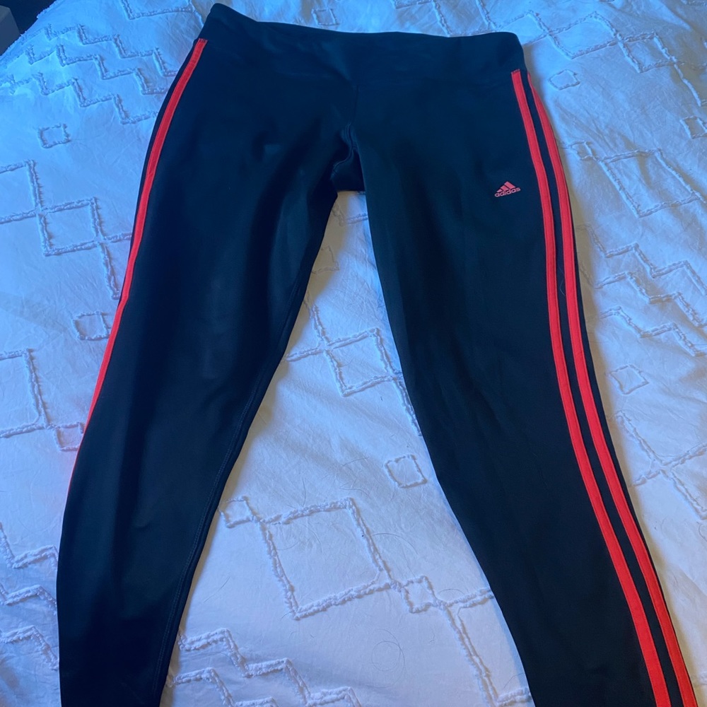 Adidas 7/8 length black and bright pinky-orange stripes.